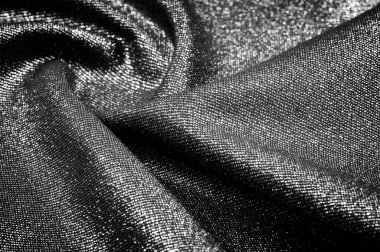 Metalik gümüş iplikle kaplanmış gri kumaş. Bu kumaşlar herhangi bir proje, duvar kağıdı ve tüm tasarım çözümleri için idealdir. ve birçok geminin kullanımı..