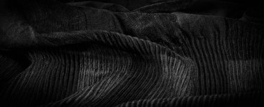 Siyah krep, ipek, yün veya sentetik liflerden oluşan ve belirgin bir şekilde pürüzlü görünümlü bir kumaştır. Doku, arkaplan, desen