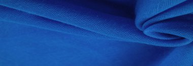 Lacivert ipek kumaş, mavi ince tahıl kumaşı. Masaüstü ürünü, görüntü perspektifi, stüdyo fotoğrafçılığı. ürün demo afişi.