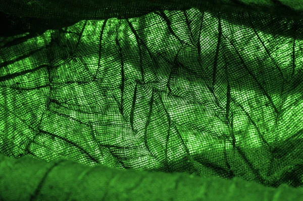 Texture. Background. Background. Dark green luxury shiny fabric texture, this is an abstract silk fabric background