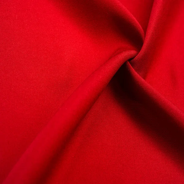 red silk fabric, this is silk satin weaving. Differs in density, smoothness and gloss of the front side, softness, Texture, background