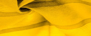 Sarı renkli ipek kumaş, doku. Geçmişi. Tayftaki yeşil ve turuncu arasındaki renk, maviye tamamlayıcı bir birincil renk; olgun limon ya da yumurta sarısı gibi renklendirilmiş.
