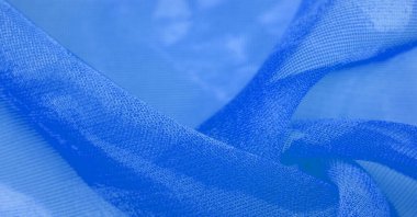 Mavi ipek kumaş, gök mavisi ipekten soyut bir arkaplan. Kumaşlı kumaş. Uzayı kopyala Tasarım elemanı. Sevgililer Günü. Doku deseni, süs, arkaplan