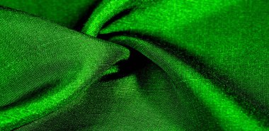 Yeşil kumaş. Doğal kumaştan soyut kırmızı arkaplan. Pamuk. Doku, arkaplan, desen