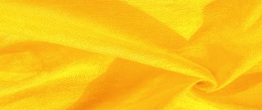 Parlak sarı madde. Bu ipek son derece pürüzsüz ve yumuşak, güzel pürüzsüz bir dokusu var. arkaplan deseni