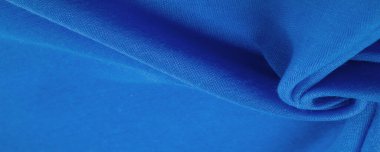 Lacivert ipek kumaş, mavi ince tahıl kumaşı. Masaüstü ürünü, görüntü perspektifi, stüdyo fotoğrafçılığı. ürün demo afişi.