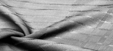 Çizgileri olan basit gri kumaş. İpin, dokunun, arkaplanın çıkarılması ile oluşturulan çizgiler