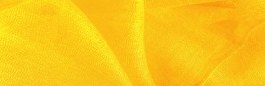 Parlak sarı madde. Bu ipek son derece pürüzsüz ve yumuşak, güzel pürüzsüz bir dokusu var. arkaplan deseni