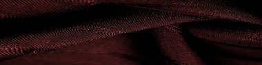 Çizgileri olan basit kırmızı kumaş. İpin, dokunun, arkaplanın çıkarılması ile oluşturulan çizgiler