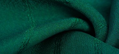 Çizgileri olan basit yeşil kumaş. İpin, dokunun, arkaplanın çıkarılması ile oluşturulan çizgiler,