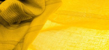 Sarı renkli ipek kumaş, doku. Geçmişi. Tayftaki yeşil ve turuncu arasındaki renk, maviye tamamlayıcı bir birincil renk; olgun limon ya da yumurta sarısı gibi renklendirilmiş.