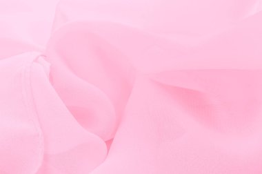 İpek kırmızı polyester. Pembe ipek kumaşın arka planı. Şeffaf arkaplan ve elbise dikmek için açık kumaştan yapılmış. Tekstil panoraması. Dokuma. şablon.