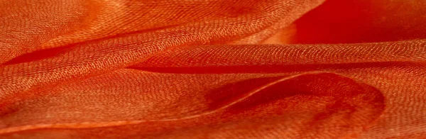 Parlak kırmızı madde. Bu ipek son derece pürüzsüz ve yumuşak, güzel pürüzsüz bir dokusu var. arkaplan deseni