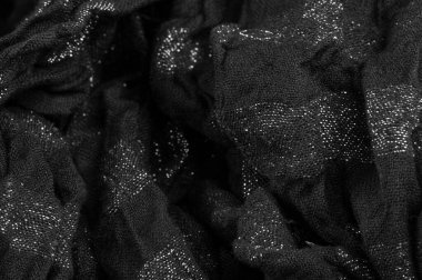 Doku. Geçmişi. Geçmişi. Yazdırılmış çizgileri olan siyah şeffaf kumaş.