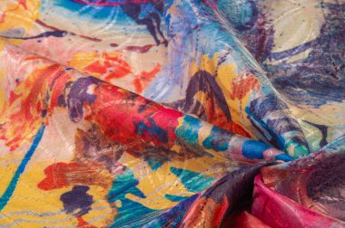 Boyalı bir palette ipek kumaş, soyut çizim, parlak renkler, kırmızı-sarı-mavi renk, sınırsız hayal gücü. doku, arkaplan, desen,