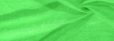Parlak yeşil malzeme. Bu ipek son derece pürüzsüz ve yumuşak, güzel pürüzsüz bir dokusu var. arkaplan deseni