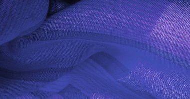 İpek kumaş gök mavisi, parlak mavi, bulutsuz bir gökyüzü gibi. Doku. Arkaplan.