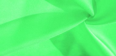 Yeşil renkli ipek kumaş. Bu ipek inanılmaz derecede zarif. Bundan yapılan projeler uzun süre devam edecek ve hala oldukça iyi durumda olacak.