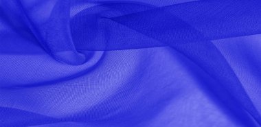 Mavi ipek kumaş dokusu. Pürüzsüz, zarif mavi ipekten ya da saten kumaştan. Lüks kumaş. soyut bir arkaplan olarak kullanılabilir.