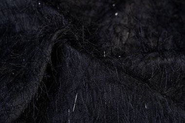 Kumaşın yüzeyinde pullu ve iplikli kömür siyah ipek kumaş. Bu ombre tülleri soyut işlemelerle süslenmiş, bir Avrupalı tasarımcının pulları ve iplikleriyle süslenmiş.