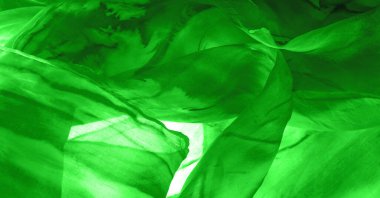 Yeşil arka planda gri lekeli yeşil kumaş. Soyut tasarımcı kumaş tasarımcısı. Tasarımın için güzel bir arka plan. Doku. Görüntü. çizim, kalıp, şekil