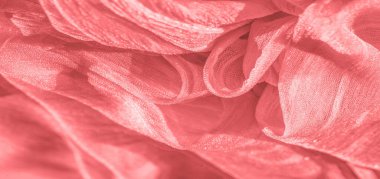 İpek kumaş. Kırmızı kırışık kumaş dokusu. Kırmızı buruşuk peri dokusu dalgalı yüzey, yakın çekim, yumuşak odak. arkaplan, kalıp