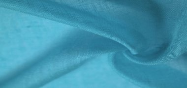 Mavili ipek kumaş. Pürüzsüz mavi ipek ya da lüks saten kumaş dokusu soyut bir arkaplan olarak kullanılabilir. Lüks Noel arkaplanı