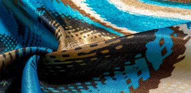 İpek kumaş. Renkler: Mavi, siyah, mor, bej. Doku, ipek panorama, arka plan güzel, yumuşak bulanık. Soyutlama