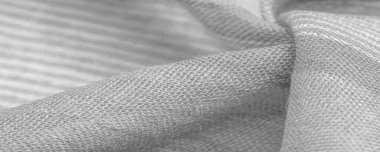 Beyaz çizgili gri-beyaz kumaş, projeleriniz için kalın ve parlak bir kumaş. Muazzam çeşitlilikte yumuşak düzlükleri var. desen, tasarım