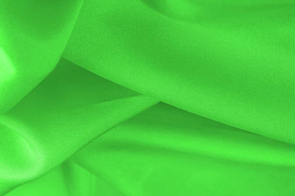 Yeşil ipek kumaş, zarif, dalgalı, yeşil saten ipek lüks kumaş, soyut tasarım. arkaplan dokusu, desen