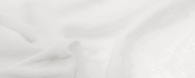 Beyaz kumaş. Lüks kumaşın soyut arka planı ya da dalgaların sıvı ipek dokusu ya da dalgalı kıvrımlar. arka plan ya da zarif duvar kağıdı tasarımı. Pamuk dokusu, doğal kumaş ve boya.