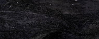 Kumaşın yüzeyinde pullu ve iplikli kömür siyah ipek kumaş. Bu ombre tülleri soyut işlemelerle süslenmiş, bir Avrupalı tasarımcının pulları ve iplikleriyle süslenmiş.