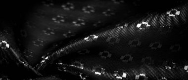 Siyah ipek kumaş, küçük kare desenli eşkenler. Tasarımında zenginlik ve lüks. Arkaplan dokusu, dekoratif süs