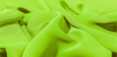 Kumaşın kenarında püsküllü yeşil ipek bir şal. Bu yaygın bir kravat türüdür. Beyaz arka planda sıcak yeşil. Şablon