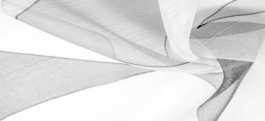 siyah ve beyaz, tek renkli geometrik renkler, ince yapışkan ipekten yapılmış bir peçe gibi. Organza deseni. İnce örülmüş kumaş - şeffaf,
