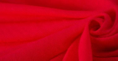 Kırmızı bez. Lüks kumaşın soyut arka planı ya da dalgaların sıvı ipek dokusu ya da dalgalı kıvrımlar. arka plan ya da zarif duvar kağıdı tasarımı. Pamuk dokusu, doğal kumaş ve boya.,
