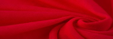 Kırmızı bez. Lüks kumaşın soyut arka planı ya da dalgaların sıvı ipek dokusu ya da dalgalı kıvrımlar. arka plan ya da zarif duvar kağıdı tasarımı. Pamuk dokusu, doğal kumaş ve boya.,