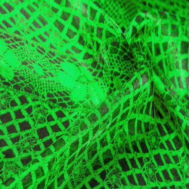 Yeşil dantel kumaş, yeşil ve siyah kumaşın karışımı. Zümrüt, doku, arkaplan, şekil.