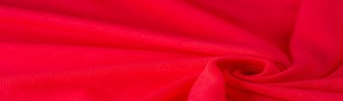 Kızıl Pamuk. Lüks kumaşın soyut arka planı ya da dalgaların sıvı ipek dokusu ya da dalgalı kıvrımlar. arka plan ya da zarif duvar kağıdı tasarımı. Pamuk dokusu, doğal kumaş ve boya, parlak kırmızı renk..