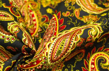 Siyah arka planda desenli desenler. Polyester pamuk, bu bote kullanılarak süslemeli bir tekstil, kavisli üst ucu olan gözyaşı damlası şeklinde bir motif. İran kökenli