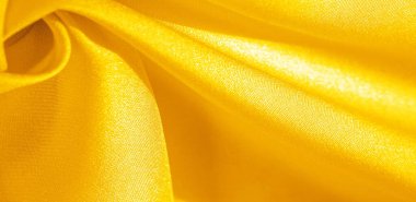 Sarı ipekli kumaş. Bu ipek inanılmaz derecede zarif. Bundan elde edilen projeler uzun süre devam edecek ve hala oldukça iyi durumda olacak..
