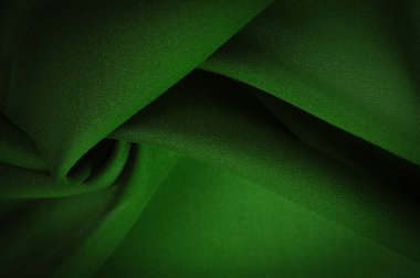 İpek yeşili kumaş. Zümrüt-ipek kumaş, hafif ipek ve rahat dayanıklı ipek kumaş ve çok yönlülük yaratır, geniş çeşitlilikteki tasarım uygulamaları için uygun hale getirir.