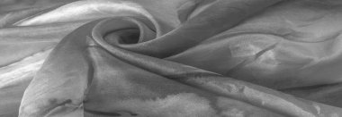 Beyaz arka planda gri benekli siyah beyaz kumaş. Soyut tasarımcı kumaş tasarımcısı. Tasarımın için güzel bir arka plan. Doku. Görüntü. çizim, kalıp, şekil