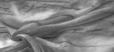 Beyaz arka planda gri benekli siyah beyaz kumaş. Soyut tasarımcı kumaş tasarımcısı. Tasarımın için güzel bir arka plan. Doku. Görüntü. çizim, kalıp, şekil