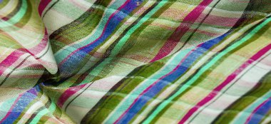 İskoç dokusunun arka plan dokusu, ki bu dokunun adı doğrudan ülkenin kökenini gösterir. Bu materyalin ikinci ve daha doğru adı tartan..