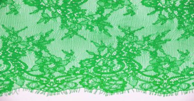 dantel kumaş. Kuş tüyü. Beyaz arka planda dantel rengi yeşil. Doku, şekil. İhtiyaçların için doğru şablonu seçme zamanı geldiğinde benim dokularıma güvenebilirsin..