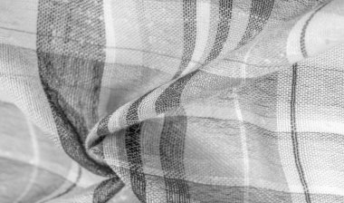 İskoç dokusunun arka plan dokusu, ki bu dokunun adı doğrudan ülkenin kökenini gösterir. Bu materyalin ikinci ve daha doğru adı tartan..