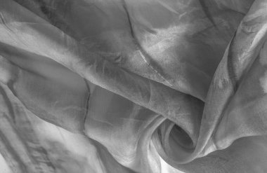 Beyaz arka planda gri benekli siyah beyaz kumaş. Soyut tasarımcı kumaş tasarımcısı. Tasarımın için güzel bir arka plan. Doku. Görüntü. çizim, kalıp, şekil