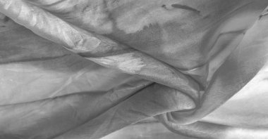 Beyaz arka planda gri benekli siyah beyaz kumaş. Soyut tasarımcı kumaş tasarımcısı. Tasarımın için güzel bir arka plan. Doku. Görüntü. çizim, kalıp, şekil