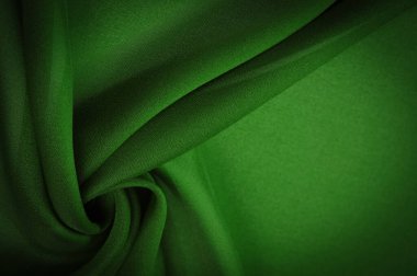 İpek yeşili kumaş. Zümrüt-ipek kumaş, hafif ipek ve rahat dayanıklı ipek kumaş ve çok yönlülük yaratır, geniş çeşitlilikteki tasarım uygulamaları için uygun hale getirir.